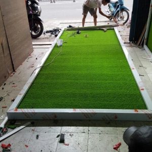 Nền biển quảng cáo bằng cỏ nhựa